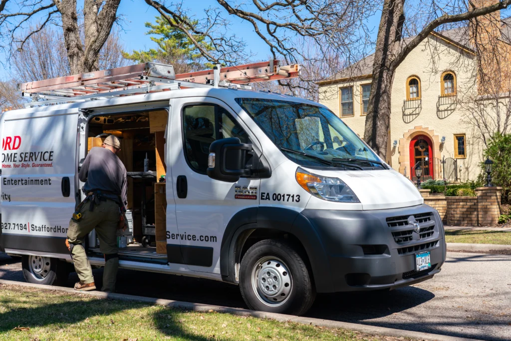 a stafford home service truck driving to perform hvac installation and repair services.