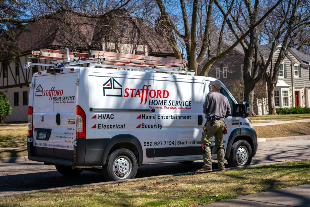 a stafford home service truck driving to perform hvac installation and repair services.