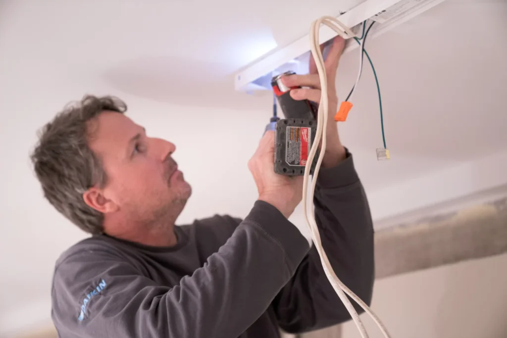 a electrician performing electrical services in wayzata, mn.