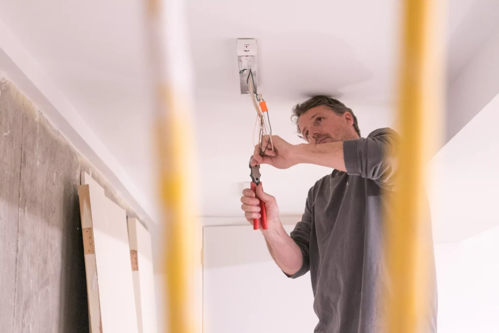 a electrician performing electrical services in rogers, mn.