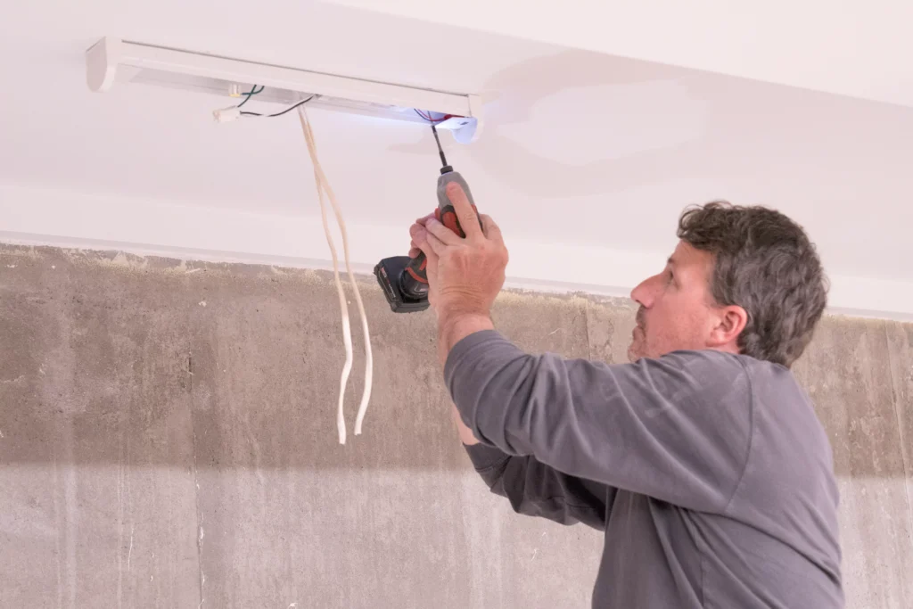 a electrician performing electrical services in maplewood, mn.