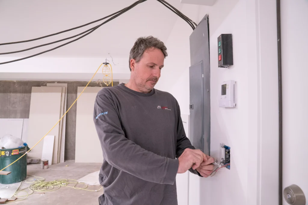 a electrician performing electrical services in elk river, mn.