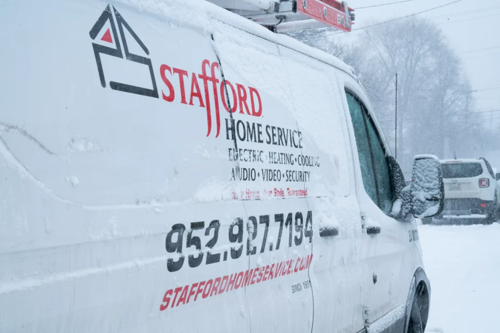 a stafford home service truck driving to perform electrical services in bloomington, mn