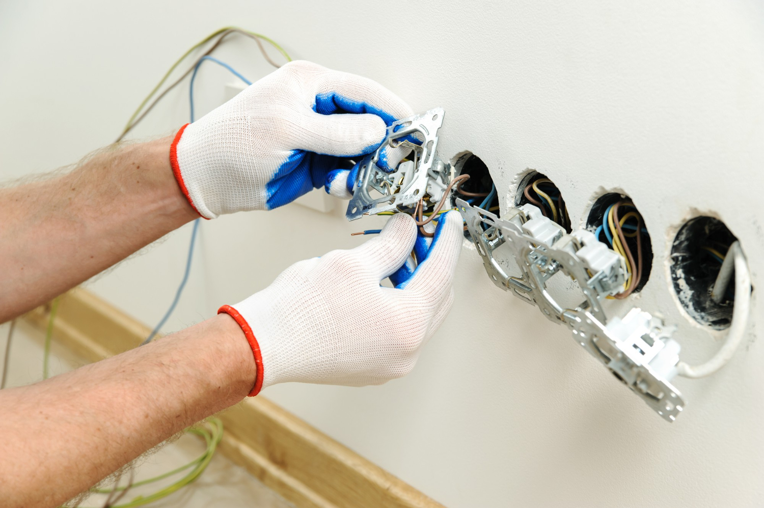 an electrician replacing old electrical system