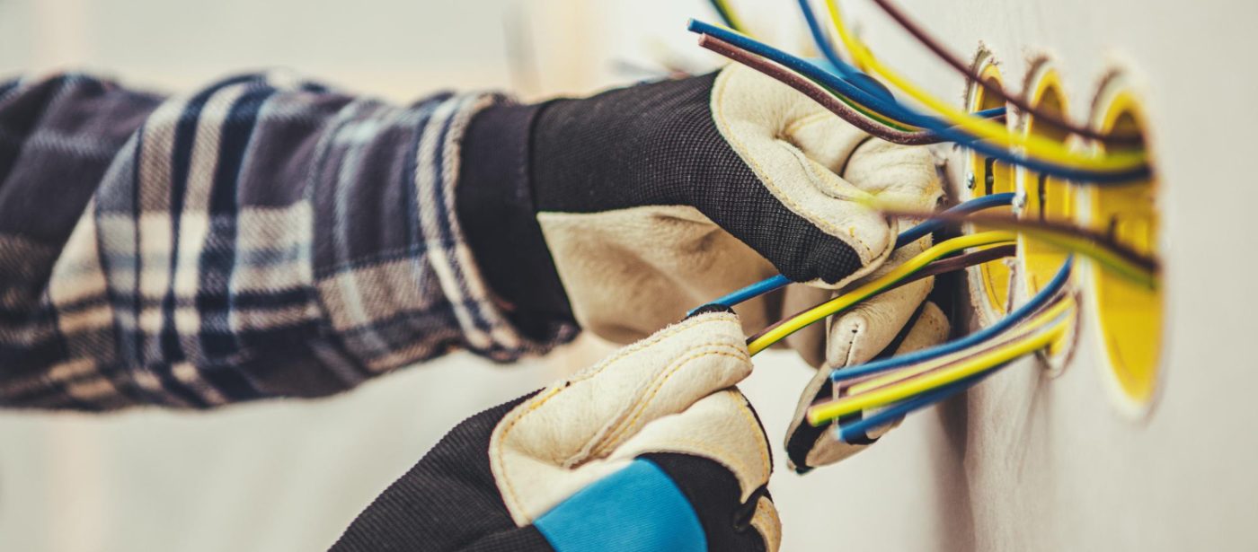 An electrician upgrading electrical system